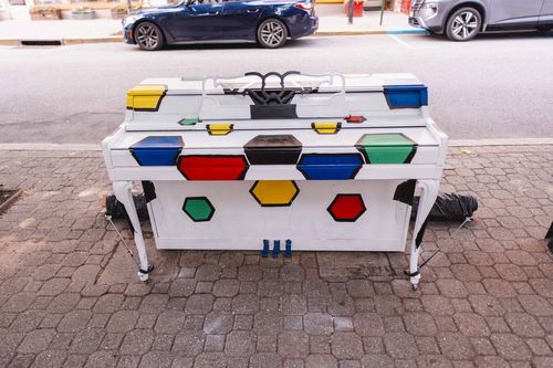 A beautifully painted piano outside the store for the charity event.