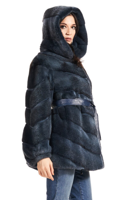 Womans dyed blueprint sheared mink jacket with hood and blue leather inserts and blue leather sash