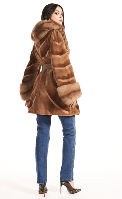 Women's whiskey colored sheared mink jacket with sable collar and cuffs and leather inserts with leather sash and hood