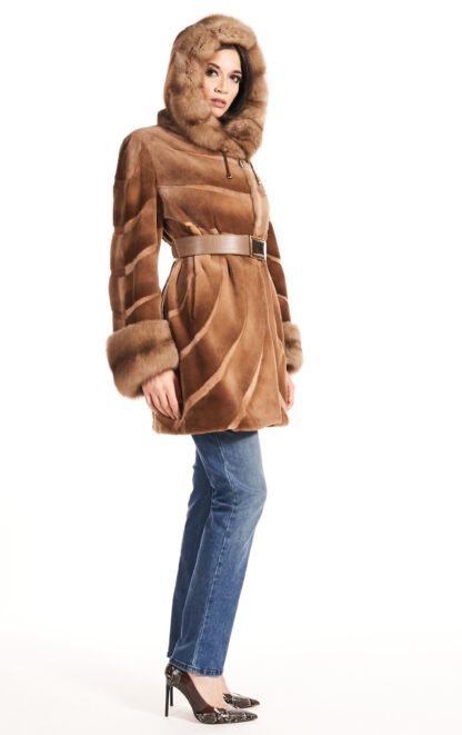 Women's whiskey colored sheared mink jacket with sable collar and cuffs and leather inserts with leather sash and hood