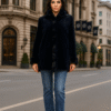 Women's navy blue sheared mink jacket with tuxedo trim.