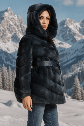 Woman's dyed blueprint sheared mink jacket with hood and blue leather inserts and blue leather sash.