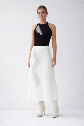 Gela Wesh Feather Halter Set – black halter top with white midi skirt and asymmetric feather embroidery